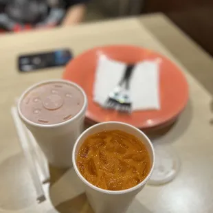 two cups of soup on a table