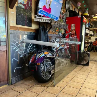 Cool Motorcycle in the restaurant.