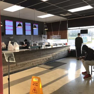 a man sitting at a counter in a restaurant