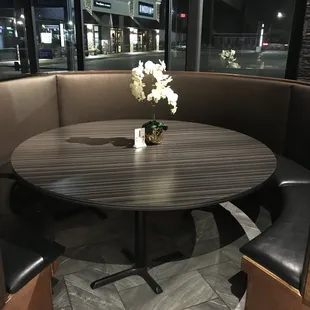 a table with a vase of flowers on it