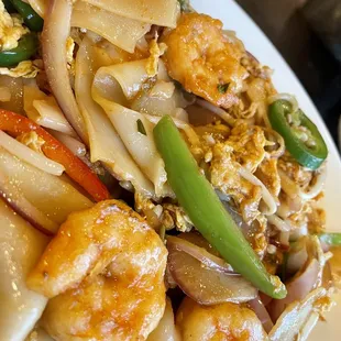 a plate of noodles and shrimp