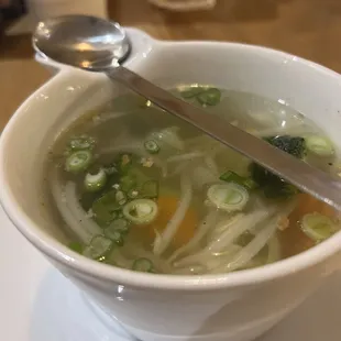 a bowl of soup with a spoon