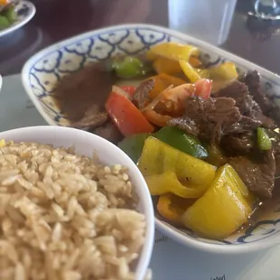 Fried egg rice and pepper steak.