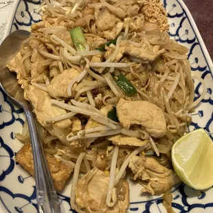 a plate of food with a spoon and fork