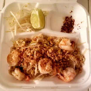 shrimp and rice in a styrofoam container