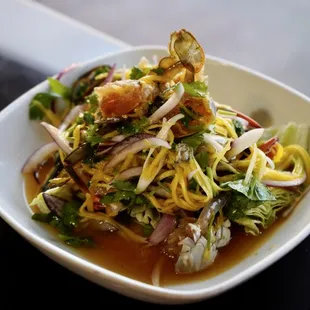 Raw blue crab marinated in fish sauce - served with mango salad
