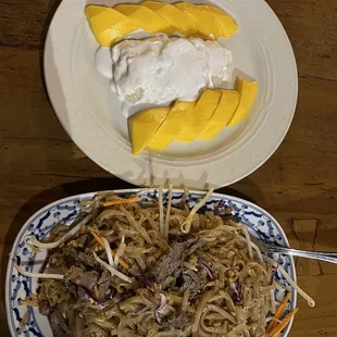 a plate of noodles and a plate of fruit