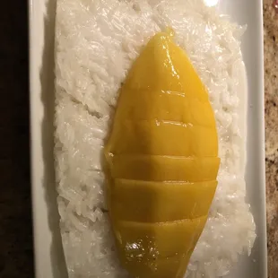 Oddly rectangular rice with two thick coconut and no sesame seeds.