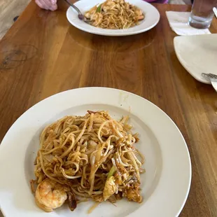 a plate of noodles and shrimp