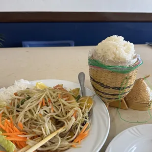 Laotian Style green spicy papaya salad with sweet sticky rice