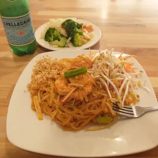 Pad Thai with shrimp, steamed vegetables (delicious!), and Perrier.