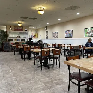 a restaurant with tables and chairs