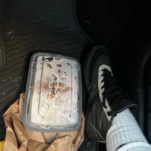 the foot of a person in a car