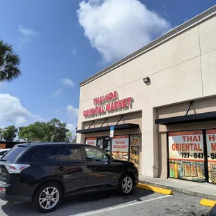 a car parked in front of the store