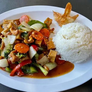 a plate of food with rice and vegetables