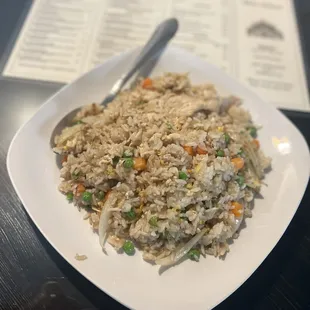 a plate of fried rice and vegetables