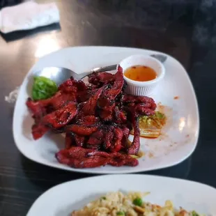 Now, the grilled pork. This one really stands out. The pork has this perfect char on it--crispy on the outside, juicy inside.