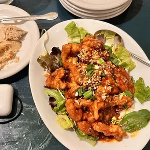 a plate of food and a bowl of rice