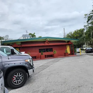 cars parked in front of the restaurant