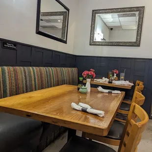 a wooden table and chairs