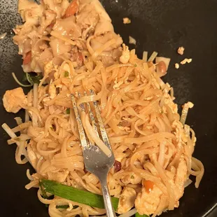 a plate of noodles and chicken