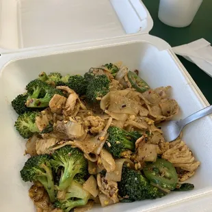 chicken and broccoli in a takeout container