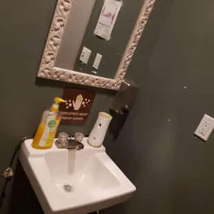 a sink and mirror in a bathroom