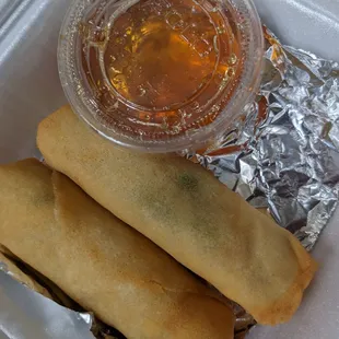 a container of food and a drink