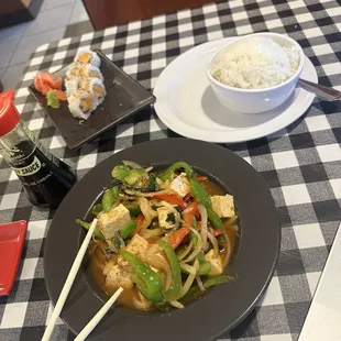 a plate of food with chopsticks