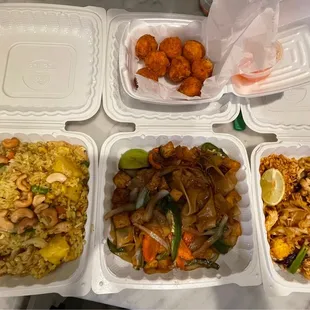 Clockwise from top: crispy rice balls, Pad Thai, S6. Pad Kee Mow Drunken Noodles, S2. Pineapple Fried Rice