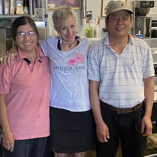 three people posing for a picture