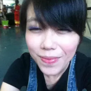 a woman holding a doughnut