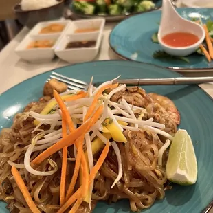 a plate of noodles and vegetables