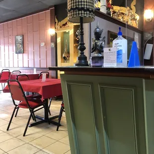 Hostess desk right by the kitchen where you pick up your food to get