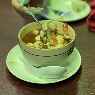 a bowl of soup with a spoon in it