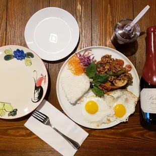 Our new lunch special ground chicken basil 2 eggs and side of jasmine rice.