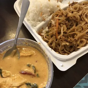 Combo lunch with phad Thai and Panang curry with chicken, half eaten