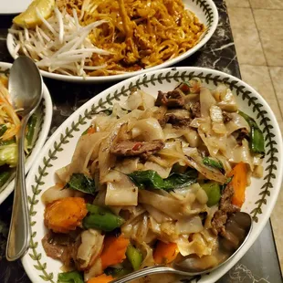 Front: Spicy basil noodle with beef (lots of meat, but a little dry) Back: Pad Thai with chicken