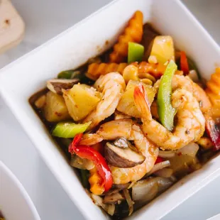 a bowl of shrimp and vegetables