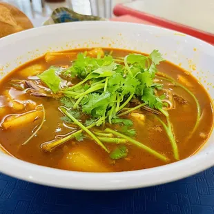 a bowl of soup and bread
