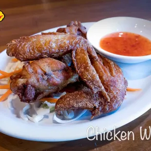 Chicken Wing Thai style deep fried chicken wings served with sweet chili sauce.