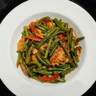 PAD PRIK KHING (Spicy Green Bean) 
 Choice of meat and stir-fried with green bean and curry paste.