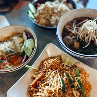 three bowls of food on a table
