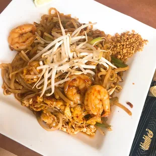 a plate of noodles and shrimp