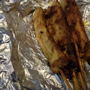 a hand holding a piece of food