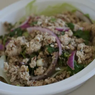 Larb chicken salad. Minced chicken with lime juice, chili, and onions.