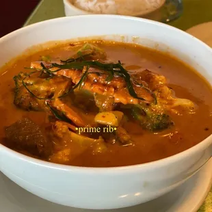 a bowl of soup and a plate of rice