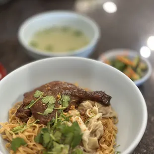 #7 Hoành Thánh Mì Vịt Tìem - braised duck leg, wontons &amp; wide egg noodles w/broth &amp; quick pickles on the side $15