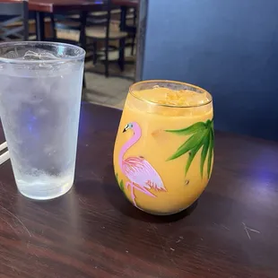 Thai iced tea and glass of water