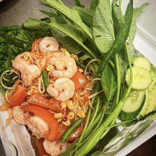 shrimp and vegetables in a styrofoam container